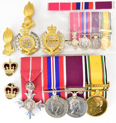 Lot 609 - A group of four medals comprising an OBE and...