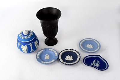 Lot 501 - WEDGWOOD; a black basalt footed vase decorated...