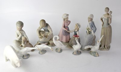 Lot 543 - LLADRÓ; a matte glazed figure of a seat boy...