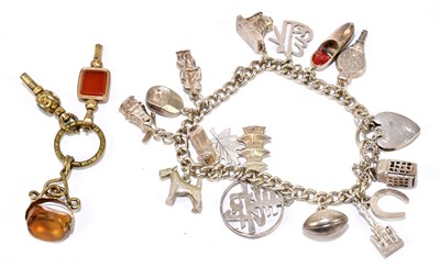 Lot 1211 - A white metal charm bracelet