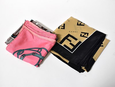 Lot 478 - FENDI; a silk scarf in the iconic black and...