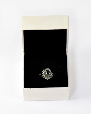 Lot 1136 - A 9ct yellow gold floral set ring with central...