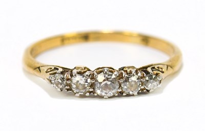 Lot 1242 - An 18ct gold diamond five stone dress ring