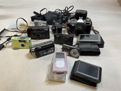 Lot 591 - A collection of cameras, an I-pod and Garmin...