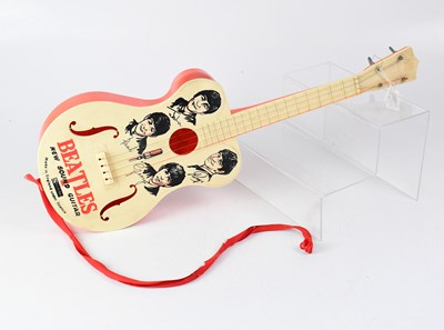 Lot 261 - THE BEATLES; a children's 'New Sound' guitar...