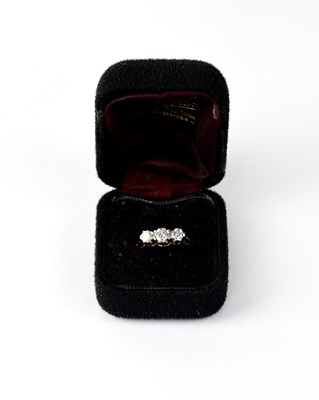 Lot 823 - An 18ct gold ring set with three graduated...