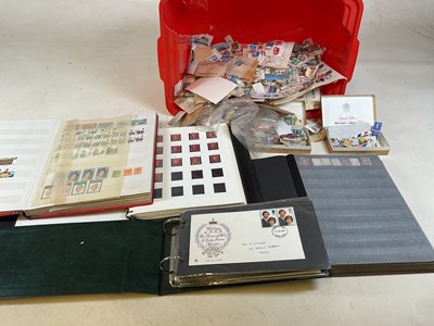 Lot 604 - A quantity of loose stamps, five part filled...