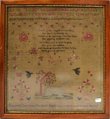 Lot 486 - A Victorian needlework alphabet sampler, with...