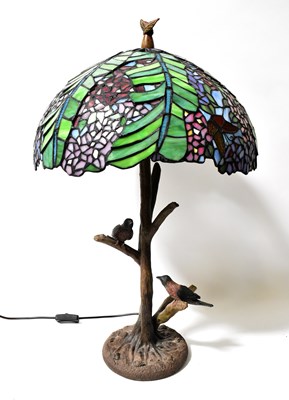 Lot 134 - A Tiffany style leaded stained-glass lamp, the...
