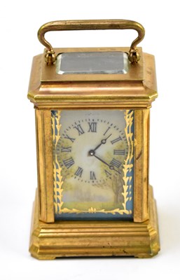 Lot 1458 - A brass cased and porcelain mounted carriage clock