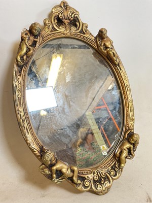 Lot 538 - A small gilt framed mirror decorated with...
