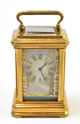 Lot 1459 - A brass cased porcelain mounted carriage clock