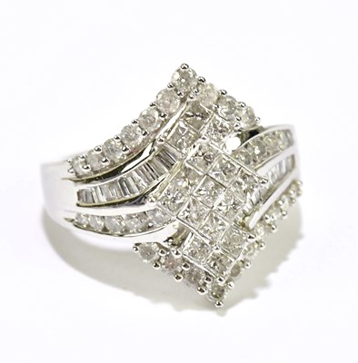 Lot 1038 - A white metal diamond set dress ring, stamped...