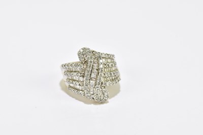 Lot 1054 - A 9ct yellow gold diamond set dress ring, with...