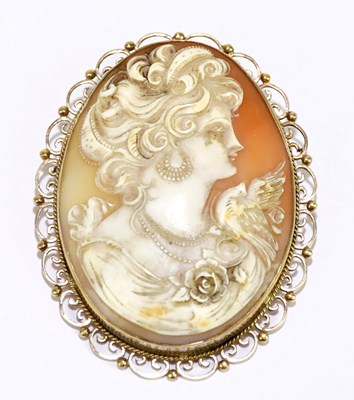 Lot 1069 - A 9ct gold mounted cameo brooch, with side...