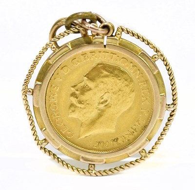Lot 969 - A George V full sovereign 1913, set in a 9ct...