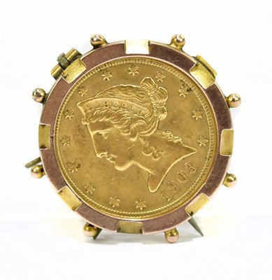 Lot 1095 - A 1903 gold Liberty coin set within a 9ct...