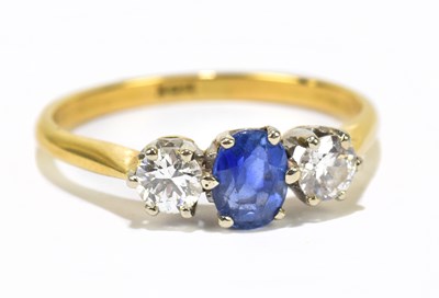 Lot 1260 - A yellow metal three stone diamond and sapphire dress ring