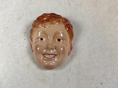 Lot 279 - BESWICK; a face mask modelled as a young boy,...