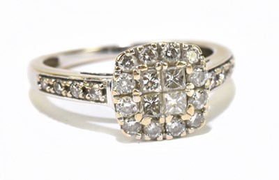 Lot 1250 - A white metal illusion set diamond dress ring