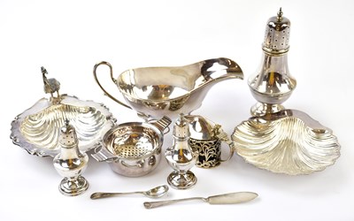 Lot 1266 - A group of hallmarked silver, comprising sauce...
