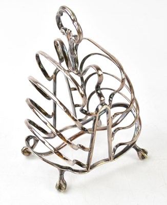Lot 1334 - An unusual white metal toast rack of stepped...