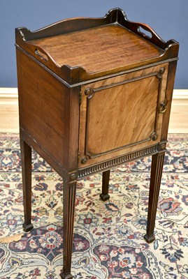 Lot 1599 - A mahogany gallery topped bedside cabinet,...