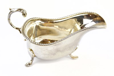 Lot 1110 - An Elizabeth II hallmarked silver sauce boat...