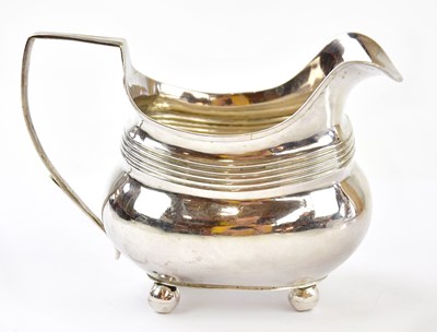 Lot 1062 - A George III hallmarked silver helmet shaped...