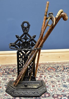 Lot 1095 - A cast iron stick stand and six assorted...