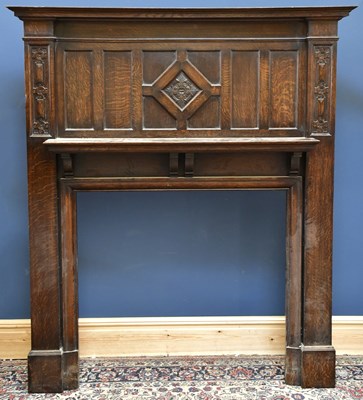 Lot 1519 - A large early 20th century oak fire surround,...
