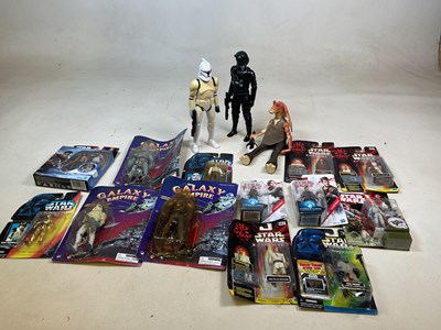 Lot 598 - A collection of Star Wars figures in original...