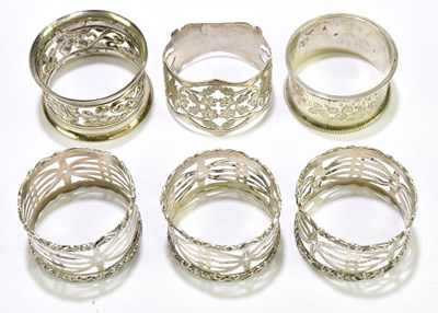 Lot 1116 - A collection of six hallmarked silver napkin...