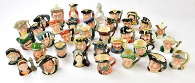 Lot 1373 - ROYAL DOULTON; a collection of thirty-six...