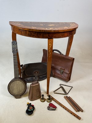 Lot 601 - An Italian inlaid musical table with lift up...