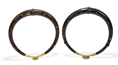 Lot 1835 - Two Nias Island brass and coconut shell...