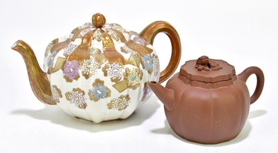 Lot 1828 - A Chinese Yixing teapot, with panelled body,...