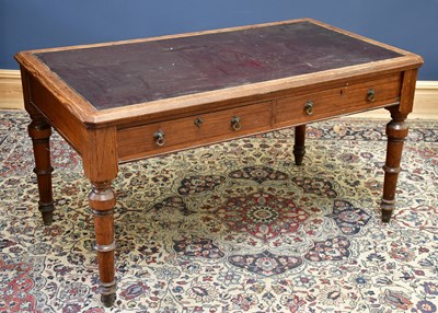 Lot 1639 - A late Victorian pitch pine writing table with...