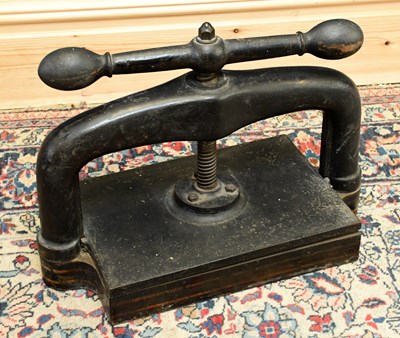 Lot 1087 - A Victorian cast iron book press, width 53cm,...