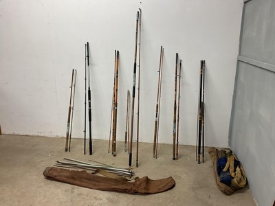 Lot 63 - A collection of 8 fishing rods, some with...