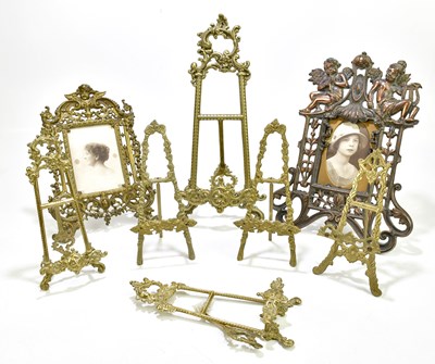 Lot 1159 - A group of six small brass easels, together...
