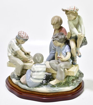 Lot 1263 - NAO: a figure group of children playing cards,...