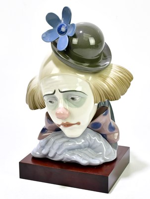 Lot 1259 - LLADRO; a bust of a clown, on wooden base,...
