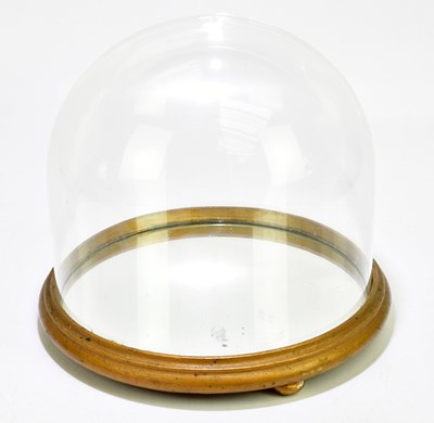 Lot 1094 - A glass dome on mirrored base, height...