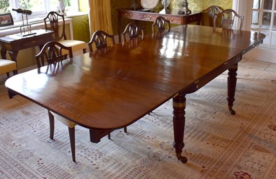 Lot 1555 - A Regency mahogany campaign dining table