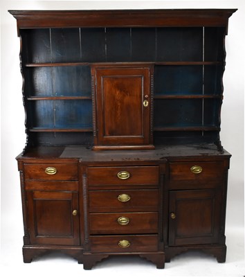 Lot 1710 - A late 18th/early 19th century oak breakfront dresser