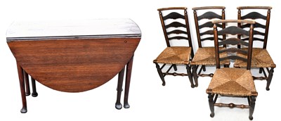 Lot 1697 - An 18th century oak drop-leaf table on turned column supports