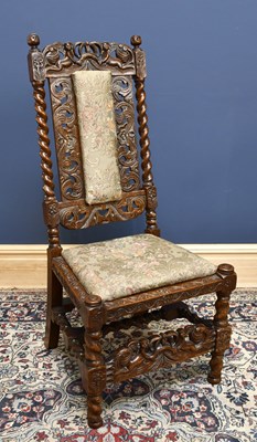 Lot 1602 - A Carolean style carved high backed chair,...