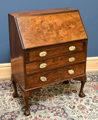 Lot 1617 - A mid 20th century walnut bureau with three...