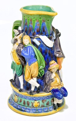 Lot 1297 - A majolia jug with relief figural decoration,...